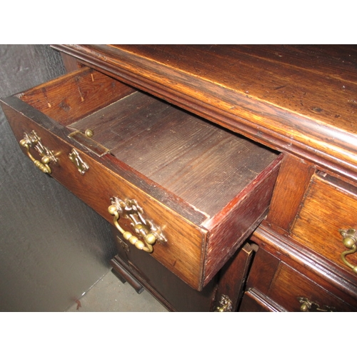 273 - An antique oak kitchen dresser, with removable top rack 3 frieze drawers, central dummy drawers and ... 