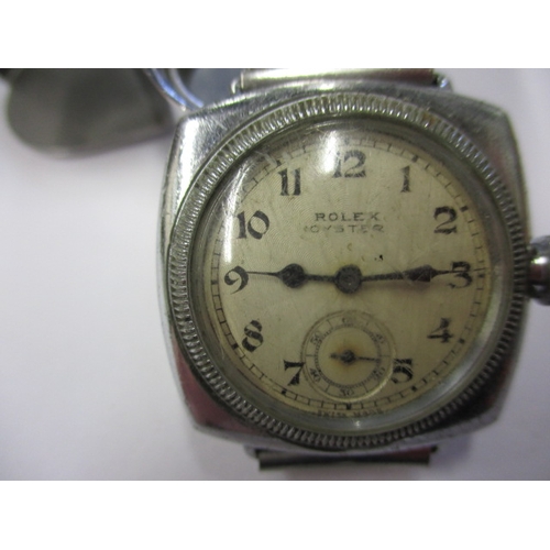 76 - An early 20th century gents Rolex Oyster cushion case wrist watch, runs when wound, having general u... 