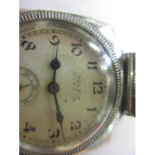 76 - An early 20th century gents Rolex Oyster cushion case wrist watch, runs when wound, having general u... 