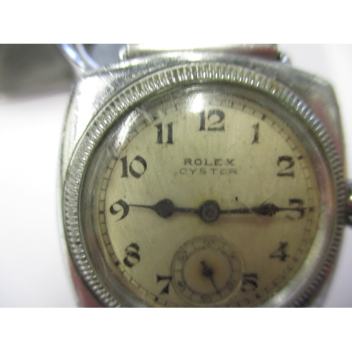 76 - An early 20th century gents Rolex Oyster cushion case wrist watch, runs when wound, having general u... 