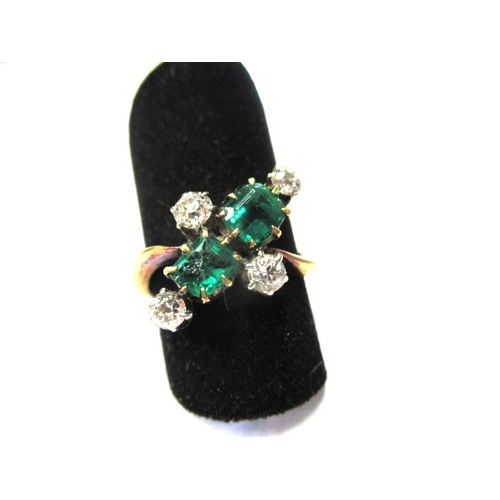 A vintage un-marked yellow gold ring with diamonds and emeralds, approx. ring size ‘J+’, approx. weight 3.45g one emerald chipped otherwise in good useable condition