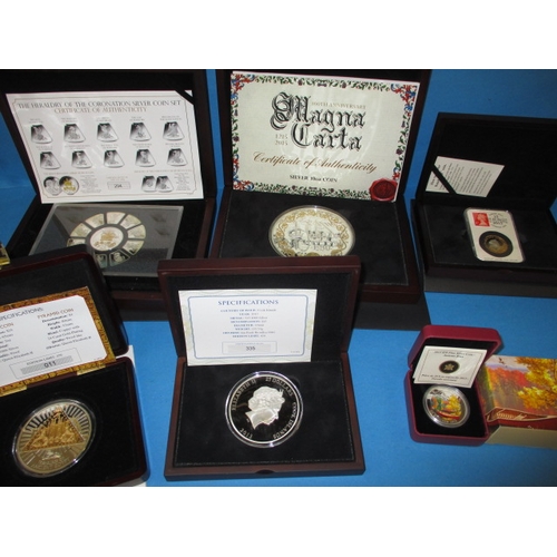 138 - A parcel of 925 silver collectors coins, to include a 10oz example, all in original presentation box... 