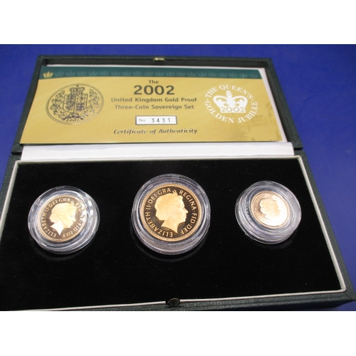 125 - A 2002 Royal Mint gold proof three coin sovereign set, consisting of Half sovereign, sovereign and d... 