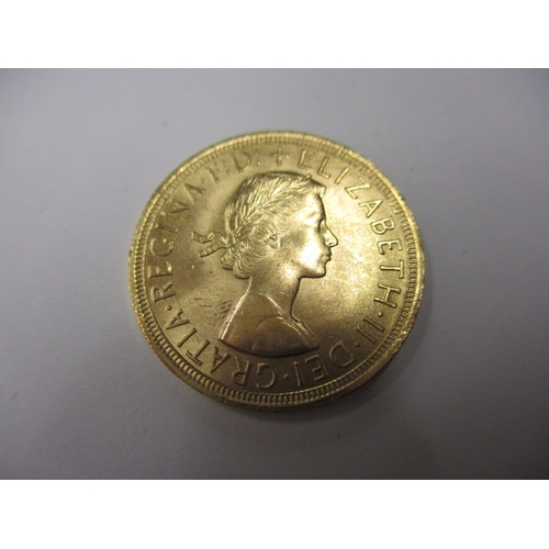 129 - A 1957 full gold sovereign in presentation box with certificate