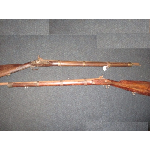 Two vintage percussion muskets, decorative items with replacement parts and age related marks, approx. length 126cm