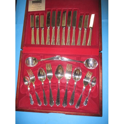 263 - A Viners 44 piece cutlery set, in original wood case, all in near unused condition