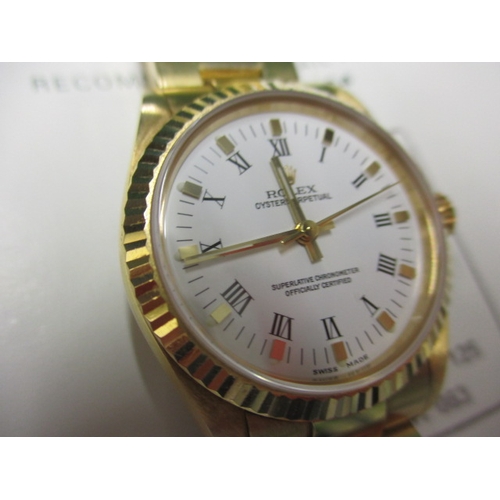 77 - A 2004 gold Rolex Oyster perpetual chronometer 77518, being marked for 18ct gold with original box a... 