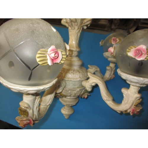 281 - Two vintage continental chandeliers, having floral and musician cherub decoration, some damages and ... 