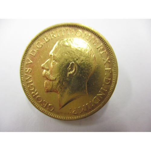 131 - A George V full gold sovereign dated 1912, a circulated coin with good definition of features