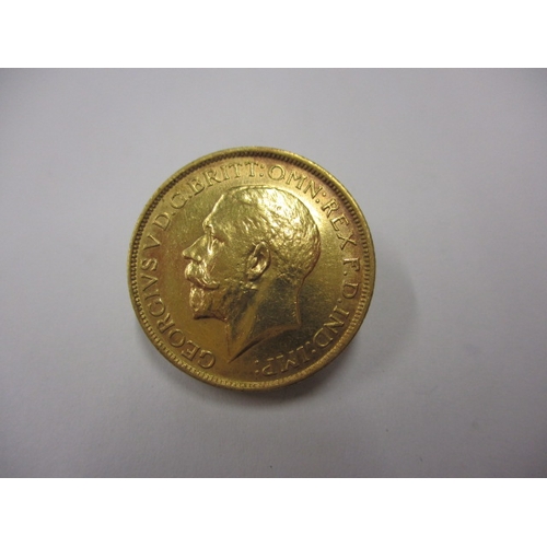 131 - A George V full gold sovereign dated 1912, a circulated coin with good definition of features