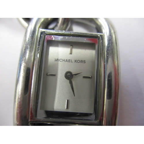 79 - A Michael Kors dress watch, having stainless steel link bracelet, in working order with general use-... 