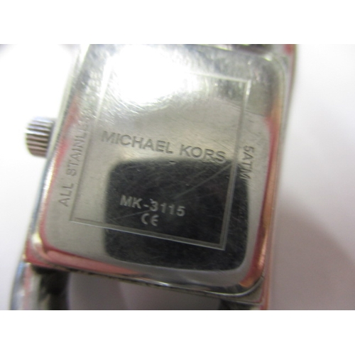 79 - A Michael Kors dress watch, having stainless steel link bracelet, in working order with general use-... 