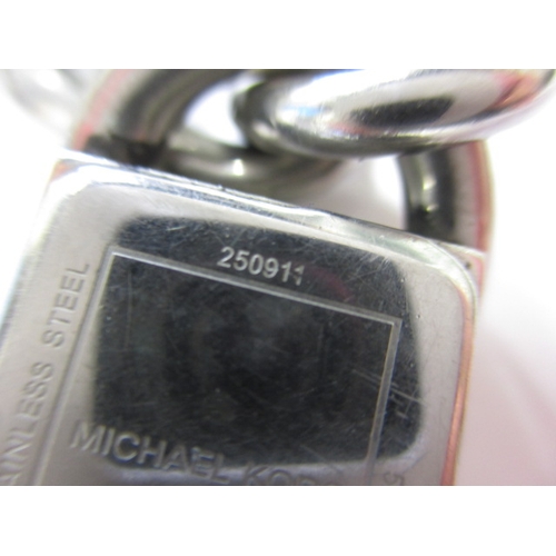 79 - A Michael Kors dress watch, having stainless steel link bracelet, in working order with general use-... 