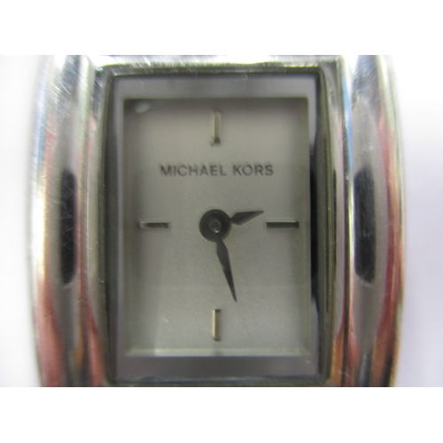 79 - A Michael Kors dress watch, having stainless steel link bracelet, in working order with general use-... 