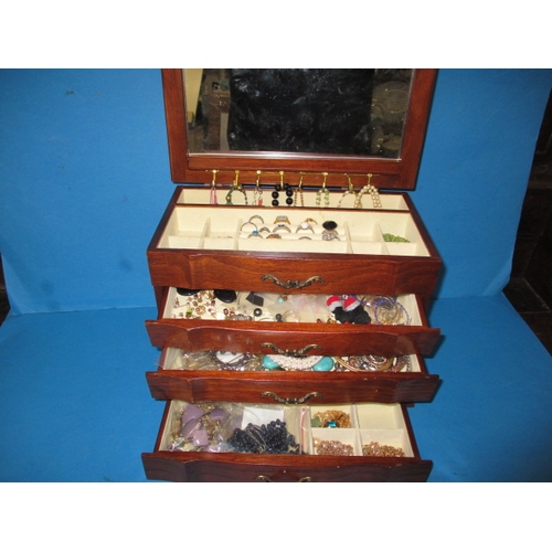 170 - ***A vintage jewellery cabinet with contents, to include an 18ct gold bracelet set with various colo... 