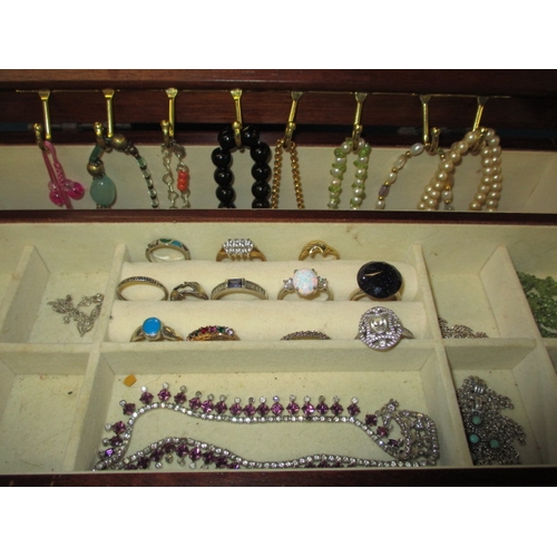 170 - ***A vintage jewellery cabinet with contents, to include an 18ct gold bracelet set with various colo... 