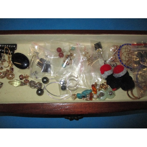 170 - ***A vintage jewellery cabinet with contents, to include an 18ct gold bracelet set with various colo... 