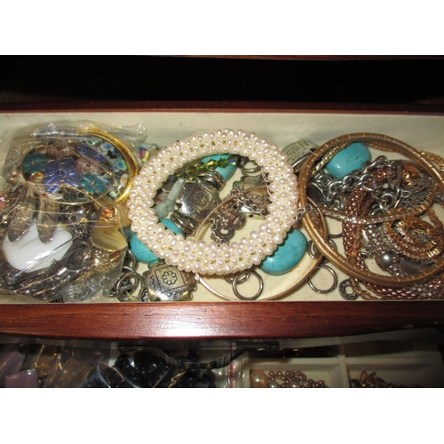 170 - ***A vintage jewellery cabinet with contents, to include an 18ct gold bracelet set with various colo... 