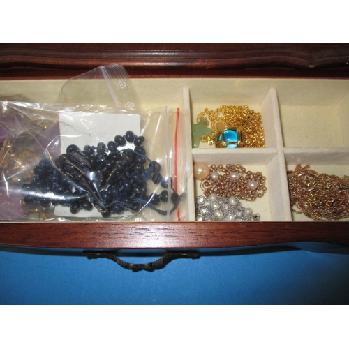 170 - ***A vintage jewellery cabinet with contents, to include an 18ct gold bracelet set with various colo... 