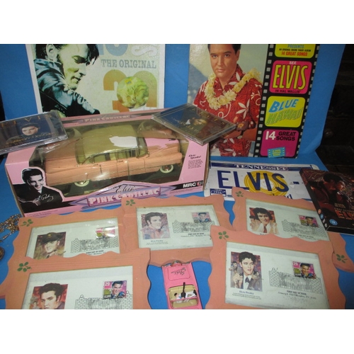 A parcel of Elvis Presley collectables, to include die-cast vehicles and first day covers, all in used condition