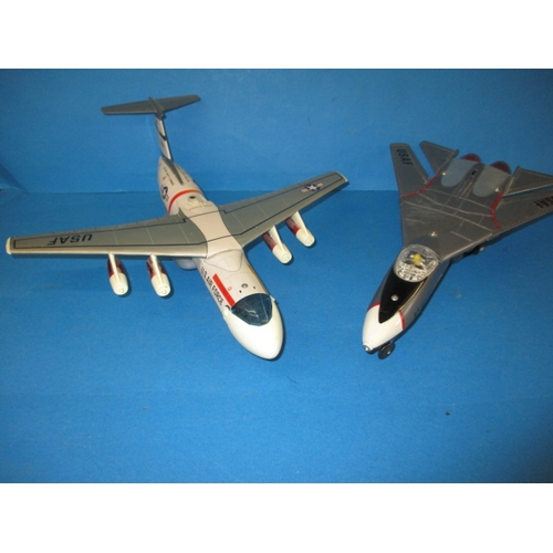 250 - Two vintage battery operated tin and plastic model aircraft, both believed to be in working order wi... 