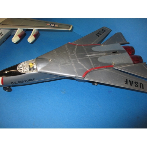 250 - Two vintage battery operated tin and plastic model aircraft, both believed to be in working order wi... 