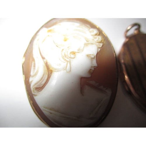 31 - A 9ct gold locket and a gold mounted cameo brooch, both in used condition, approx. weight of locket ... 