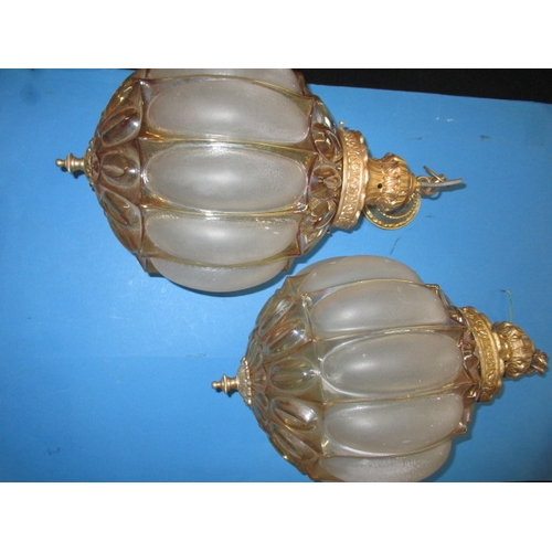 280 - A pair of decorative ceiling lamps, each having frosted and lustre glass shades with gilt metal moun... 