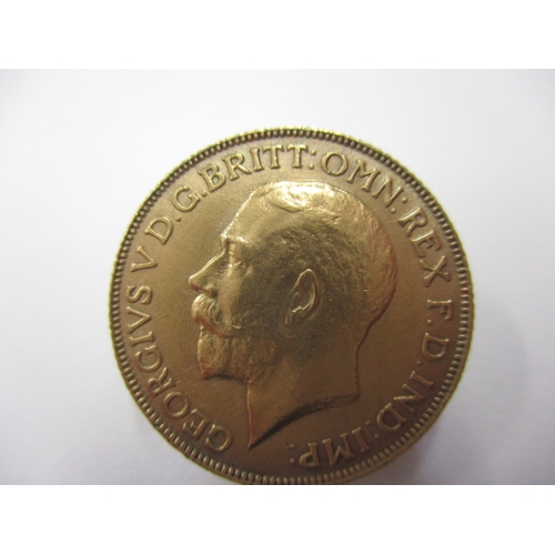 119 - A George V full gold sovereign dated 1911, a circulated coin with good definition of features