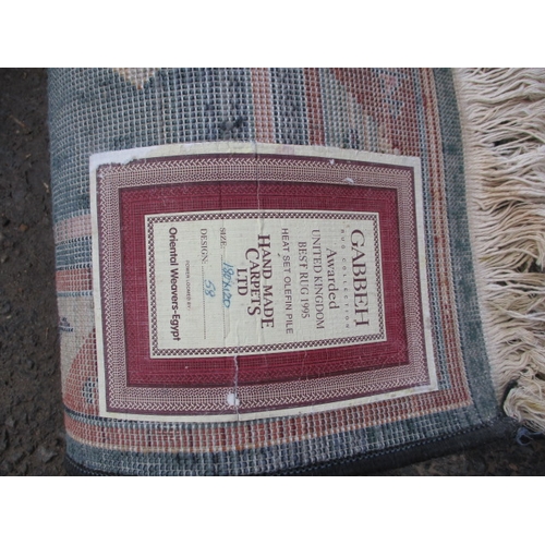 277 - A vintage Egyptian rug, approx. size 180x120cm in used condition with general use-related marks