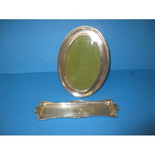 154 - A sterling silver vanity tray and an oval silver photo frame, some dents to mirror frame and general... 