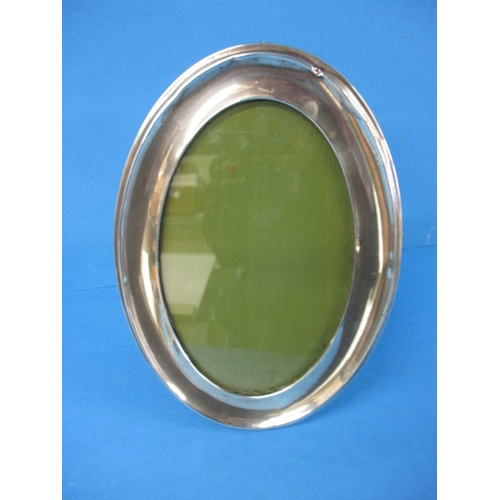 154 - A sterling silver vanity tray and an oval silver photo frame, some dents to mirror frame and general... 