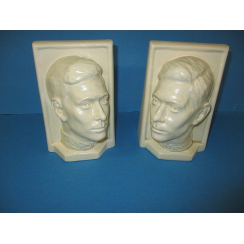 260 - A pair of Beswick matt glazed creamware bookends, by Felix Weiss dated 1937, one having a chip to ba... 