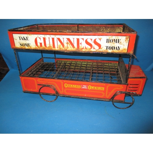 252 - A mid-20th century Guinness promotional tin-plate omnibus, approx. length 47cm having age-related ma... 