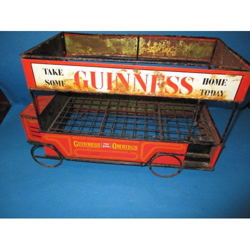 252 - A mid-20th century Guinness promotional tin-plate omnibus, approx. length 47cm having age-related ma... 