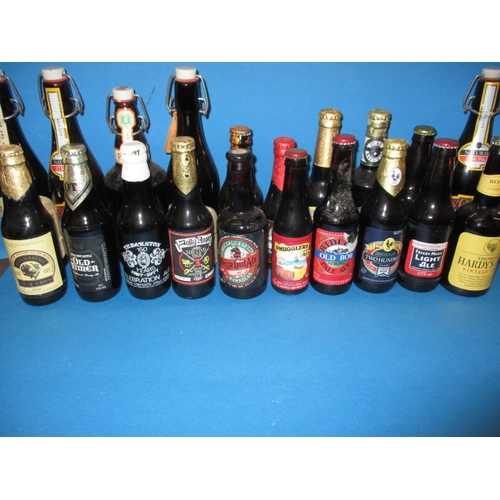 136 - Approx 60 bottles of vintage beer, various makers, all unopened and with contents