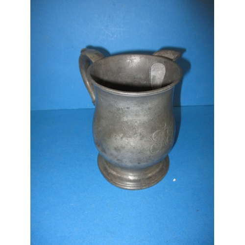 124 - A Victorian pewter pub tankard jug, having Leather Bottle Cobham name to base, having initials to fr... 