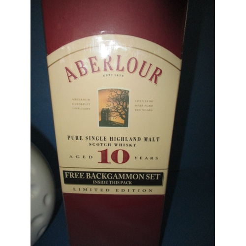 150 - A limited edition boxed bottle of Aberlour 10 year single malt Scotch whisky and a 70cl golf ball bo... 