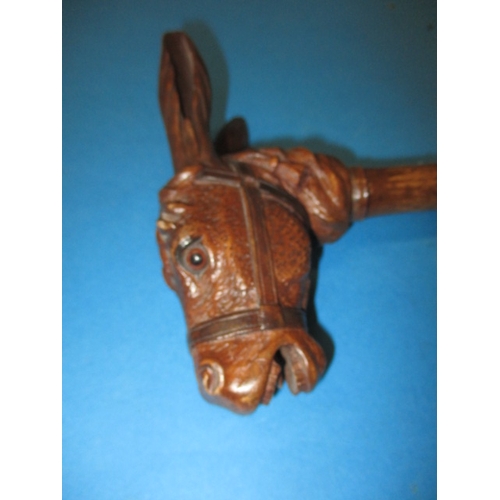 109 - An early 20th century Paragon novelty parasol by Fox & Co Limited, being a well carved donkeys head ... 