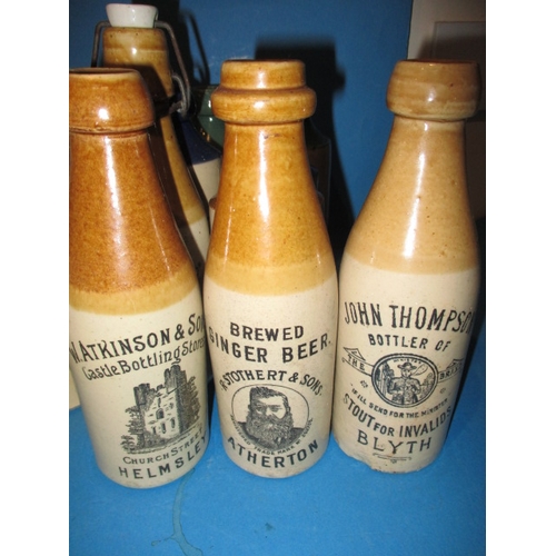 123 - 34 Vintage stoneware ginger beer bottles to include blue and green top examples, all in used conditi... 