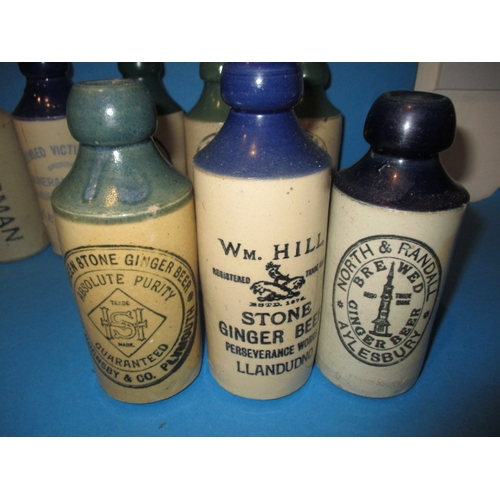 123 - 34 Vintage stoneware ginger beer bottles to include blue and green top examples, all in used conditi... 