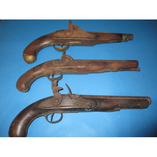 103 - Three antique pistols, two percussion and one flint lock, all with age related ware and would benefi... 