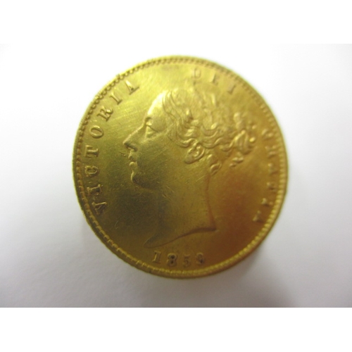 31 - A Victorian gold half sovereign dated 1859 with shield back, a circulated coin with very good defini... 