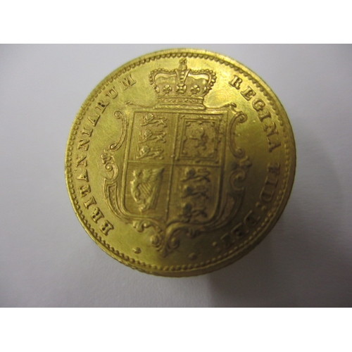 31 - A Victorian gold half sovereign dated 1859 with shield back, a circulated coin with very good defini... 