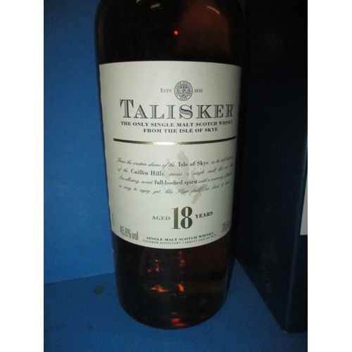 154 - A 70cl bottle of Talisker 18 year old single malt whisky, with original card box, settled mid-neck