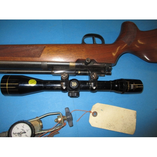 106 - A Titan .177 air rifle, cylinder filled, with scope, not tested as to function, with gauge and spann... 