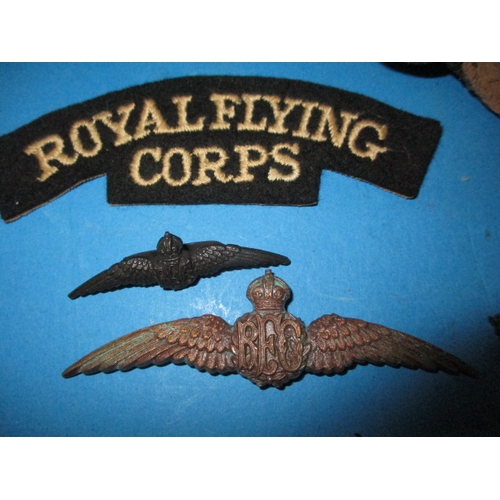 94 - A vintage leather flying helmet made by D Lewis, a Bronze Royal Flying Corps wings badge and some as... 