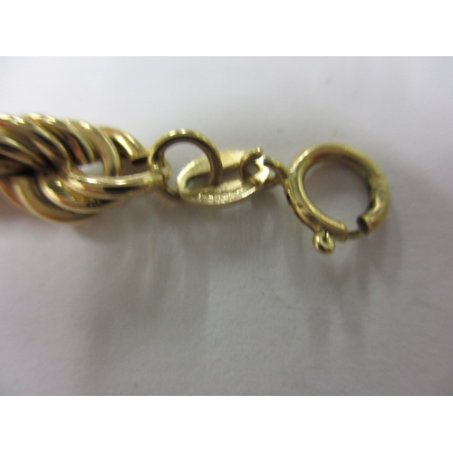 23 - A matching 9ct gold rope necklace and bracelet, approx. linear lengths 18cm and 39cm, both with work... 