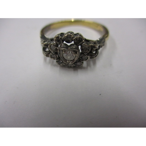 3 - A vintage 18ct gold and diamond ring, with central diamond set heart shaped motif, approx. ring size... 