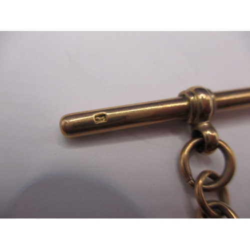 24 - A vintage yellow metal albert chain, T bar marked 9ct, approx. weight 30.8g in used condition